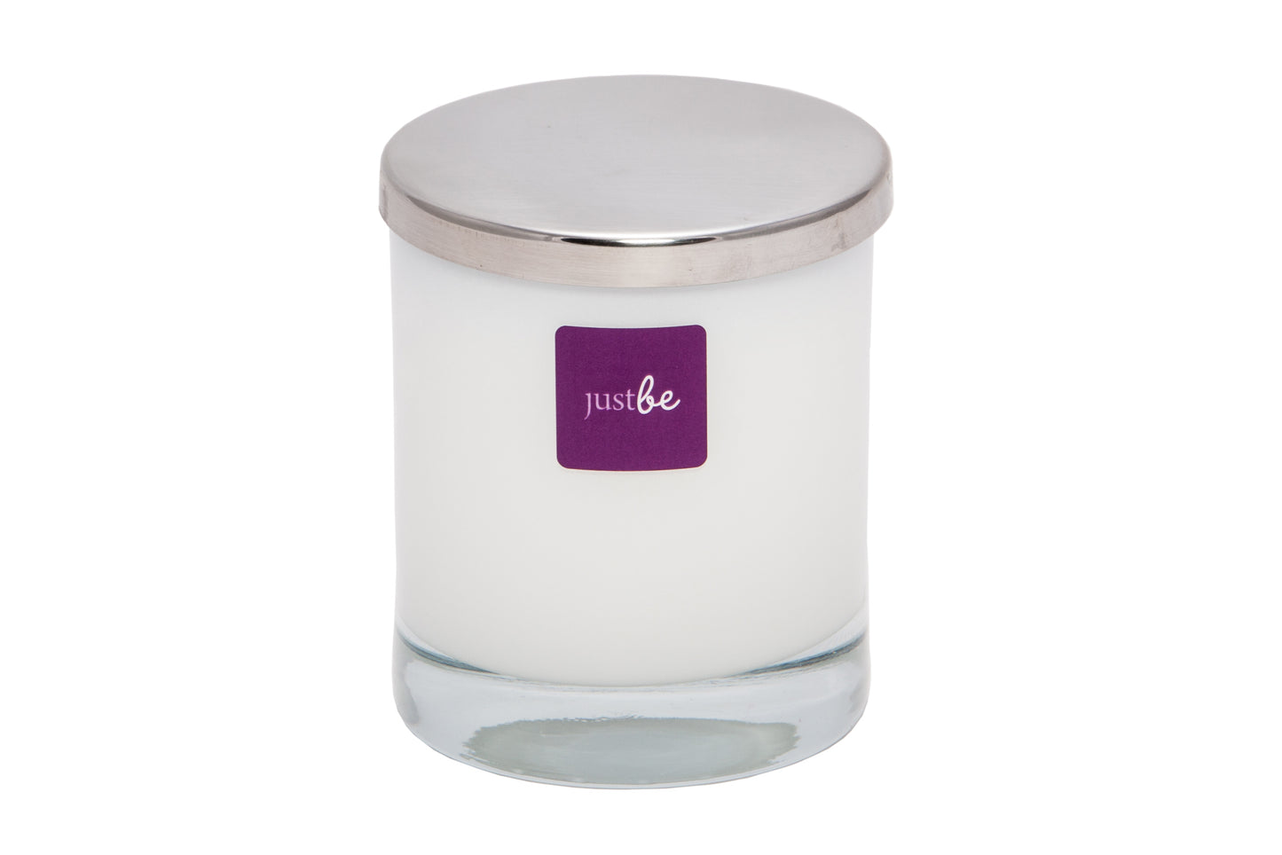JustBe Traquil candle in a white glass container with a silver lid and purple 'just be' label. Sitting against a white background