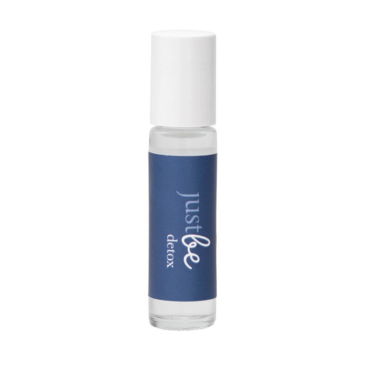 JustBe Detox pulse point oil: cleansing  aromatherapy blend to support clarity and balance in a  rollerball bottle with navy blue label and white lid