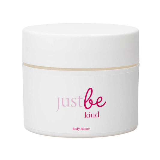 White jar of just be kindbody butter with a white label on a white background