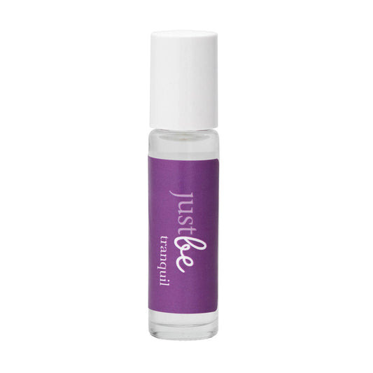 JustBe Tranquil pulse point oil: calming aromatherapy blend of cedarwood,  lavender and geranium to ease tension and promote relaxation. In a cleat rollerball bottle with  purple label and white cap.