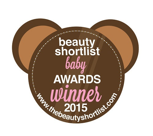 JustBe Botanicals Beauty Shortlist Baby Awards Winner 2015 badge featuring a circular brown design with bear ear shapes, and white and pink text displaying the award details. 