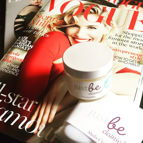 JustBe Botanicals Cleansing Balm & Muslin Cloth sitting on top of VOGUE magazine