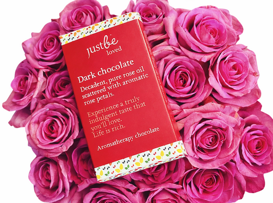 Valentine's Day self-care skincare routine with JustBe Botanicals products including cleanser, oil and chocolate