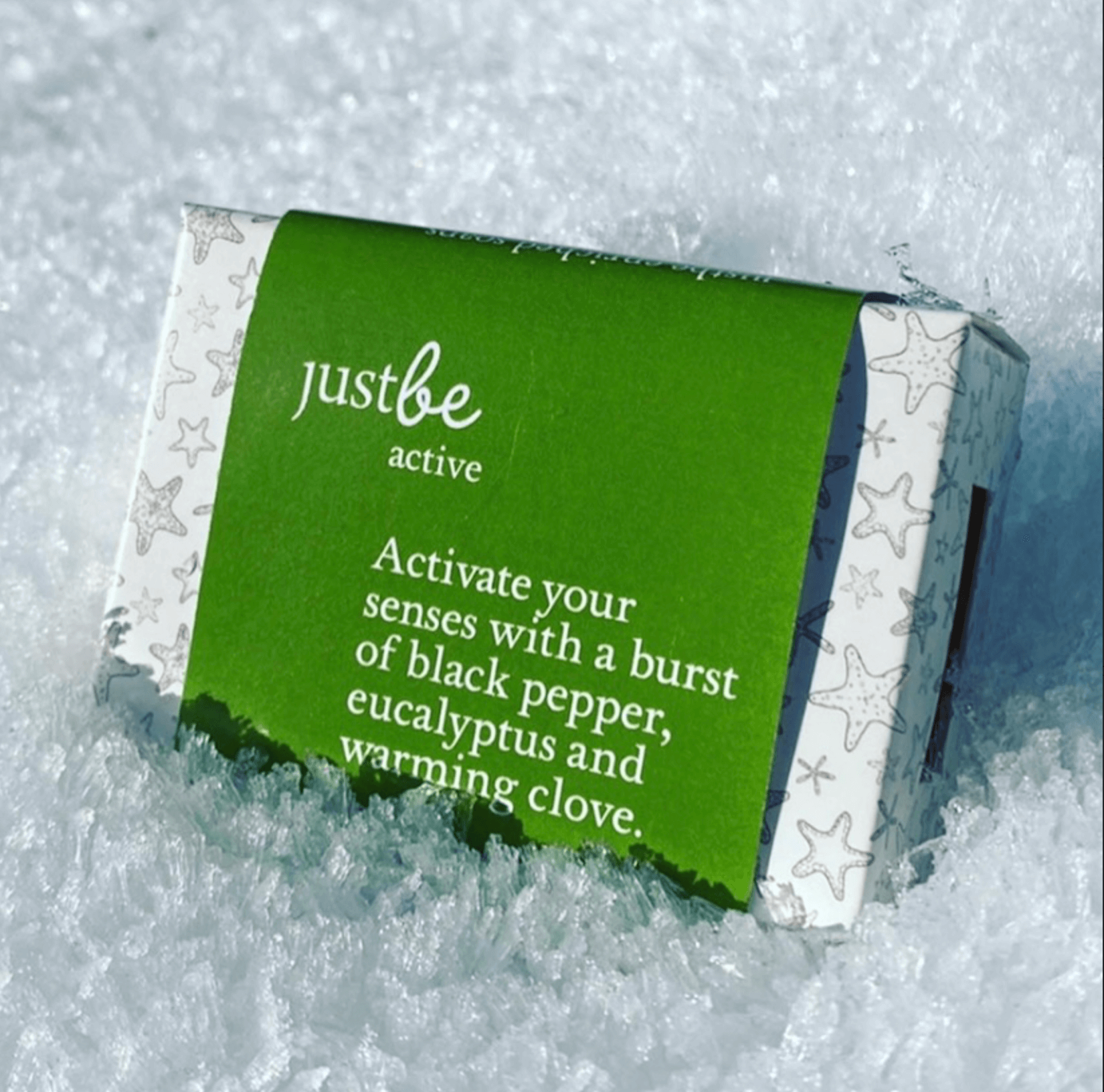 Bar of JustBe Active soap on a snowy background