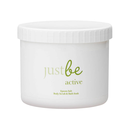 A white tub of JustBe Active Epsom salt body scrub and bath soak with the brand name and product description visible on the label.