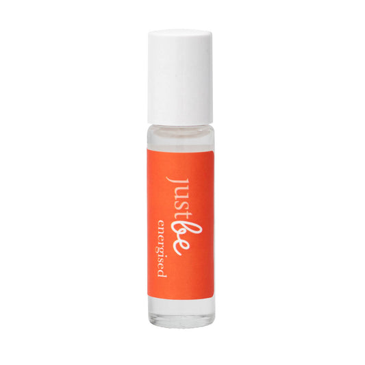 JustBe Energised pulse point oil: invigorating aromatherapy blend with citrus essential oils to boost energy and focus in an orange rollerball bottle with white lid