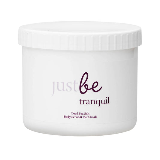 White tub of JustBe Tranquil Dead Sea Salt Body Scrub & Bath Soak with white label set against white background.